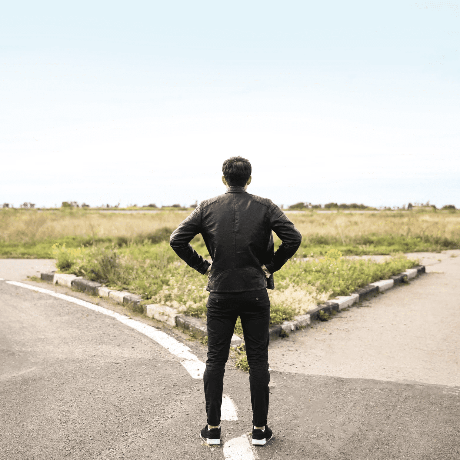 A man standing at a crossroads